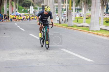 Photo for IRONMAN 70.3 LIMA, Athlete competing PERU - APRIL 23, 2023 - Royalty Free Image