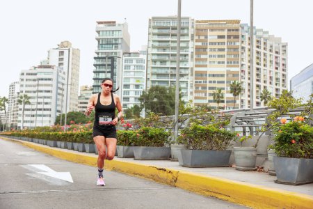 Photo for Athletes compete in the Lima Marathon 42K 2023. Running on the road, Lima Peru - Royalty Free Image