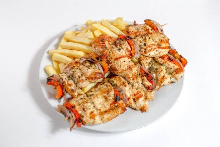 Photo for Chicken legs with french fries and vegetables - Royalty Free Image