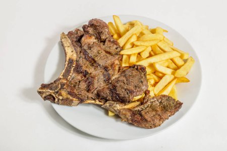 Photo for Fried pork chop with french fries and fresh vegetable - Royalty Free Image