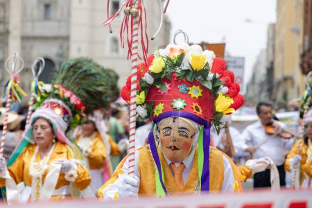 Dancers from the Ancash region with their typical costumes in the streets of Lima, Peru.