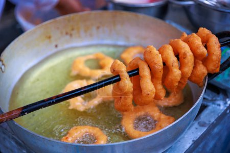 Peruvian Picarones, a delicious dessert made of wheat flour mixed with pumpkin and, sometimes, sweet potato, bathed in chancaca honey. It is a traditional dish of Peruvian gastronomy.