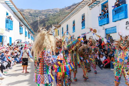 Feast of the Virgen del Carmen in Paucartambo, Cusco. Dancers and the public celebrate at the feast of the Virgen del Carmen.