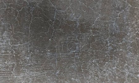 Abstrakter Hintergrund aus schäbigem Beton Wandoberfläche mit heller Farbe und verwitterten Teilen.Schöne Abstrakte Grunge Dekorative dunkle Stuckwand Background.Art Rau stilisierte Textur.Verwitterte Betonwand von beiger Farbe mit zerkratzten Ziffern bedeckt