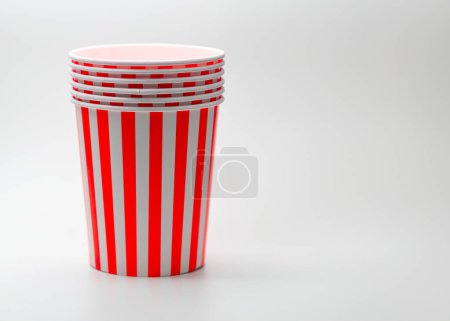 Disposable popcorn bucket with red and white stripes, empty popcorn buckets isolated on white background.
