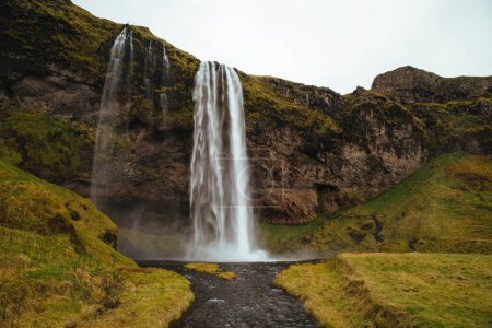 The powerful Seljalandsfoss waterfall in Iceland
