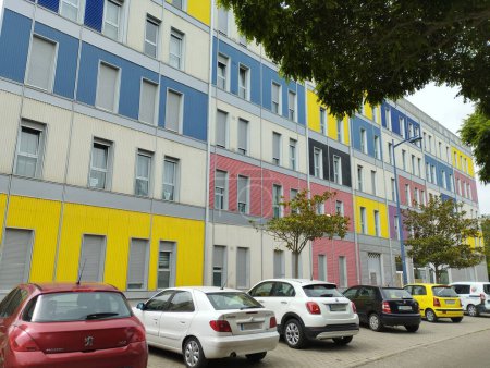 Photo for Building with colored facade, in blue, white, yellow, salmon and black - Royalty Free Image