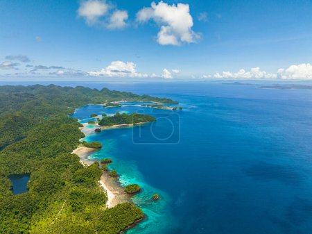 Photo for Aerial view of coastline with white sand beach. Blue sea under blue skies. Bucas Grande Island. Mindanao, Philippines. Travel concept. - Royalty Free Image