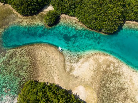 Photo for Flying above of natural transparent turquoise water in lagoon with coral reefs. Sohoton Cove. Seascape. Mindanao, Philippines. - Royalty Free Image