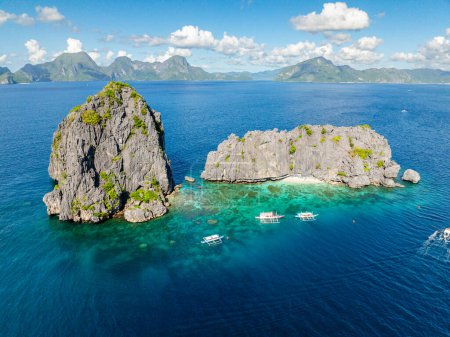 Twin Rocks under blue sky and clouds. El Nido, Palawan. Philippines.