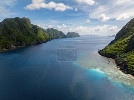 Tapiutan and Matinloc, Islands in El Nido, Palawan. Blue sky and clouds. Philippines.