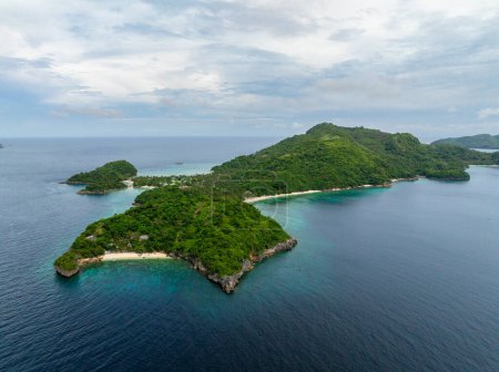 Aerial view of Alad Island with white sand beaches and corals. Romblon, Philippines.