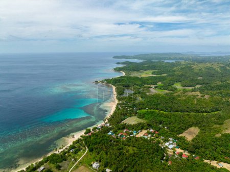 Tropical Island with farmlands and white beach at coast. Santa Fe, Tablas, Romblon. Philippines.