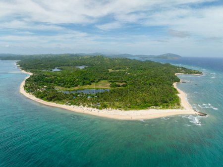 Aerial view of white sandy beach with ocean waves and turquoise sea water. Santa Fe, Tablas, Romblon. Philippines.