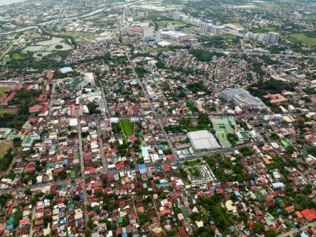 Top view of buildings and streets with cars in Iloilo City. Panay Island. Philippines.