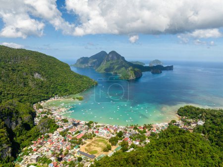 Aerial view of town in El Nido. Boats over turquoise clear sea water. Philippines.