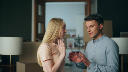 Photo for Millennial nervous couple discussing disagreement at home gesturing emotionally close up. Stressed married pair conflicting about daily problems. Wife expressing disappointing of family relationship. - Royalty Free Image