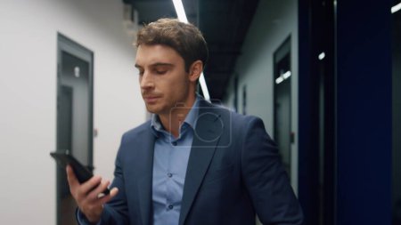 Successful investor talking mobile phone closeup. Anxious executive discussing solving problems on call. Handsome serious manager rejecting idea explaining information. Business man leaving work.