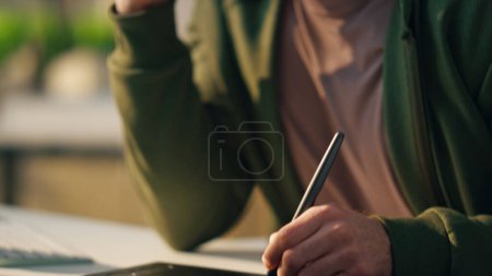 Photo for Designer hand creating tablet at sunny workplace close up. Smiling creator calling smartphone at cozy office. Creative artist drawing graphic pad computer working indoors. Happy man talking cellphone - Royalty Free Image