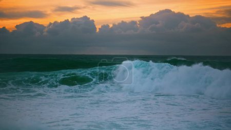 Photo for Storm sea rolling dawn coast in slow motion. Amazing endless seascape at cloudy evening sky. Foaming dramatic ocean surf swelling splashing shallow before sunrise. Beautiful seaside pastel landscape. - Royalty Free Image