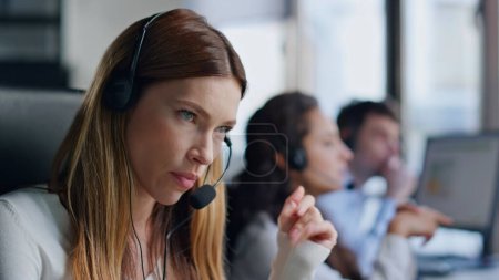 Annoyed telemarketing operator talking client closeup. Angry woman listening problem consulting customer on call. Pensive nervous agent assistant work in data center. Stressed manager at workplace.