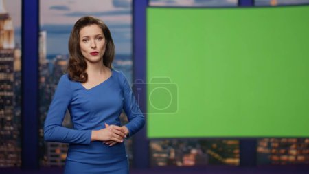 Photo for Elegant breaking news reporter showing information on green screen television studio close up. Charismatic woman presenter hosting newscast. Beautiful newsreader broadcasting daily world events in air - Royalty Free Image