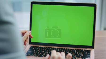 Unknown girl using chroma key laptop for office work close up. Woman hands scrolling computer touchpad watching social media at home. Unrecognizable businesswoman solving business tasks on mockup pc.