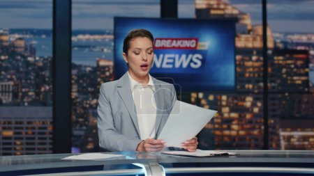 Photo for Anchor discussing daily events at television cable channel closeup. Confident lady journalist reading script bringing up important evening news at studio. Woman host translating live report at stage - Royalty Free Image