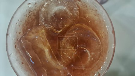 Photo for Close-up of glass filled with sweet iced tea - Royalty Free Image