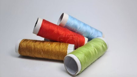Photo for Four spools of thread with different colors - Royalty Free Image