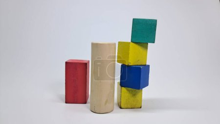 stack of colorful puzzle blocks on white surface