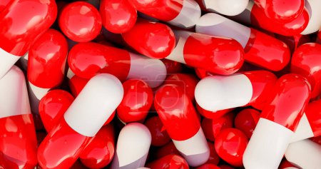 Pilules médicales rouges, capsules dans une boîte. Production industrielle de médicaments, antibiotiques ou autres médicaments.