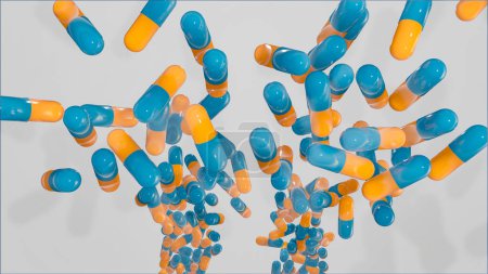 Capsules médicales orange bleu, pilules tombant dans une boîte. Production industrielle de médicaments, antibiotiques ou autres médicaments.
