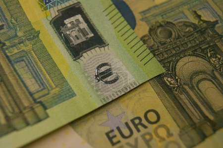 Photo for Euro symbol. A fragment of a 100 euro banknotes with a hologram. Euro symbol. - Royalty Free Image