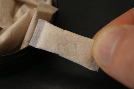  The use of nicotine pads. Close-up of the nicotine pouches.