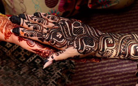 Henna tattoo on female bride hands