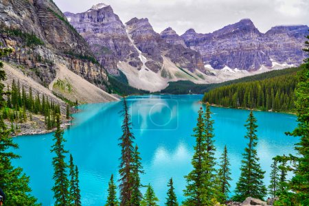 Photo for The crystal clear turquoise blue waters of Moraine Lake, the prized jewel of the Banff National Park, Alberta, Canada - Royalty Free Image