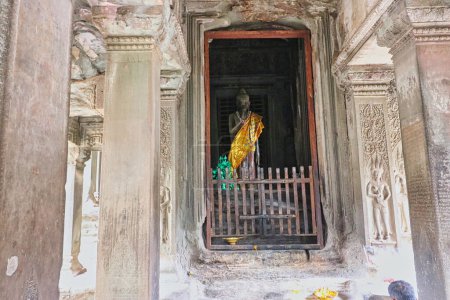 Photo for Buddha being worshipped inside the sanctum of Angkor Wat temple at Siem Reap, Cambodia, Asia - Royalty Free Image