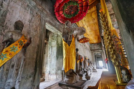 Photo for Buddha being worshipped inside the sanctum of Angkor Wat temple at Siem Reap, Cambodia, Asia - Royalty Free Image
