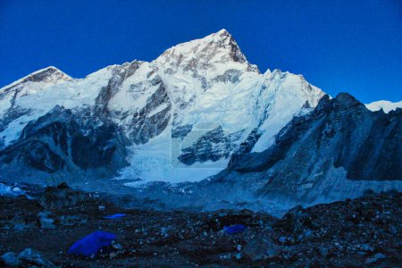 Photo for Tranquil evening photo of Nuptse 7861 meters, after sunset against an azure blue evening sky near Gorakshep,Nepal - Royalty Free Image