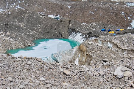 Melt pools inside the Khumbu Glacier near expedition tents in the Everest base camp, Nepal