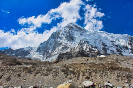 Pumori lies west of Everest and towers over the Everest Base camp in this bright lit image in the afternoon in Nepal