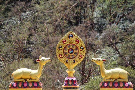 Twin deers symbolizing the skillful means and wisdom principles of Buddhist belief along with the Dhamma chakra on top of Entrance gate of Tengboche Monastery in Nepal