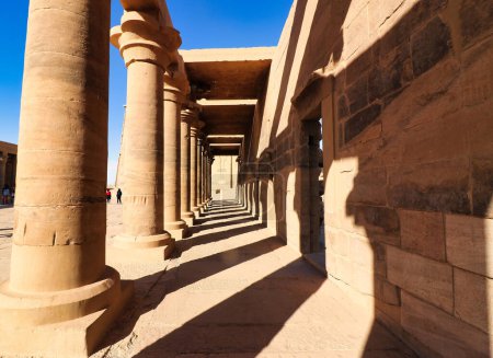 Photo for Spectacular collonade gallery in the outer courtyard in the afernoon sun the Temple of Isis at Philae Island on Lake Nasser,built by Nectanebo and Ptolemy Pharoahs near Aswan,Egypt - Royalty Free Image