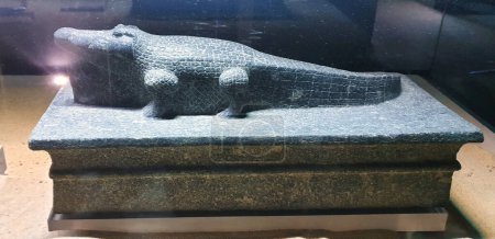 Granite sculpture of a crocodile dedicated to Sobek,protector against evil at the museum near the Temple of Sobek and Haroeris built in 2nd century BC by Ptolemy pharoahs in Kom Ombo,Near Aswan,Egypt