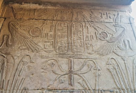 Twin Uraeus or sacred cobras bless the cartouche of Ptolemy VI Philometer in this wall relief at the Temple of Sobek and Haroeris built in 2nd century BC by Ptolemy pharoahs in Kom Ombo,Near Aswan,Egypt