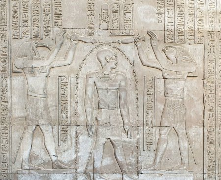 Wall relief of Ptolemy VIII Euergetes II Tryphon Purified by Thoth and Horus at the Temple of Sobek and Haroeris built in 2nd century BC by Ptolemy pharoahs in Kom Ombo,Near Aswan,Egypt