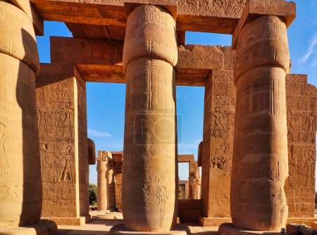 View of the main hypostyle gallery of the Ramesseum, the Mortuary Temple of Pharoah Ramesses II the Great on a bright afternoon with blue skies at Luxor, Egypt
