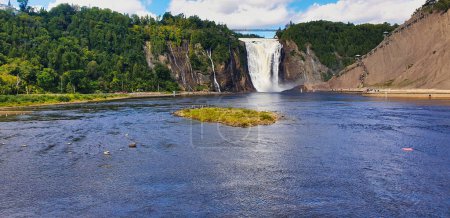 Magnificent vista of Montmorency Falls on a bright summer day with blue skies near Quebec city, the capital of Quebec province,Canada