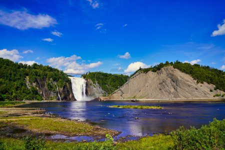 Magnificent view of the Montmorency Falls on a bright summer day with blue skies near Quebec city, the capital of Quebec province,Canada